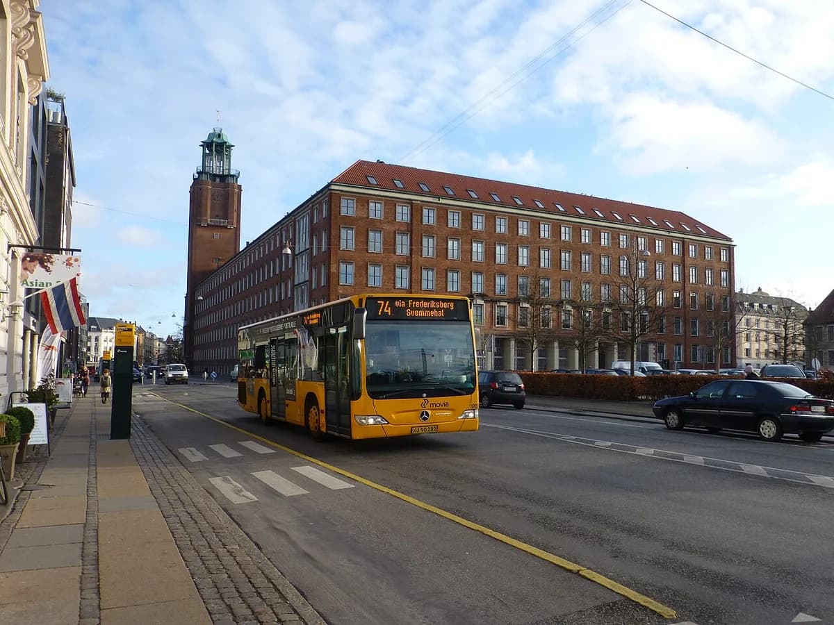 Yellow Movia bus line 74 on street near Frederiksberg Town Hall