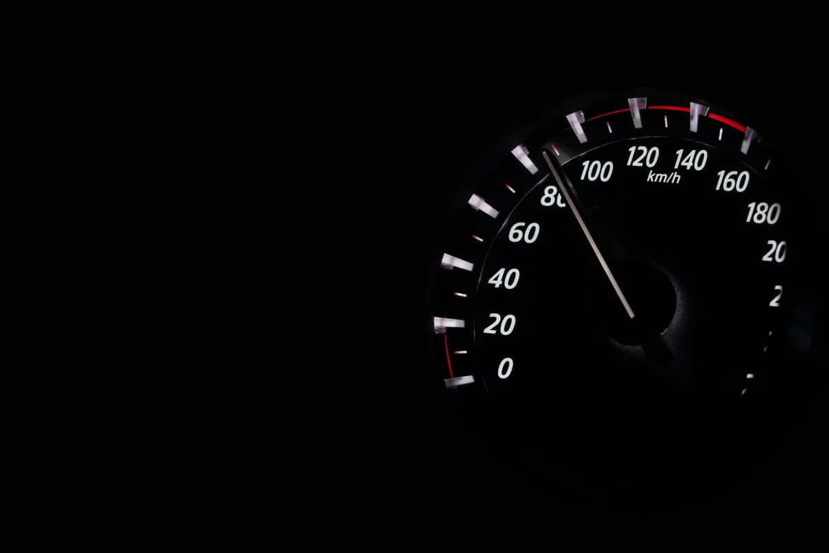 Close-up of a speedometer showing speed in km/h