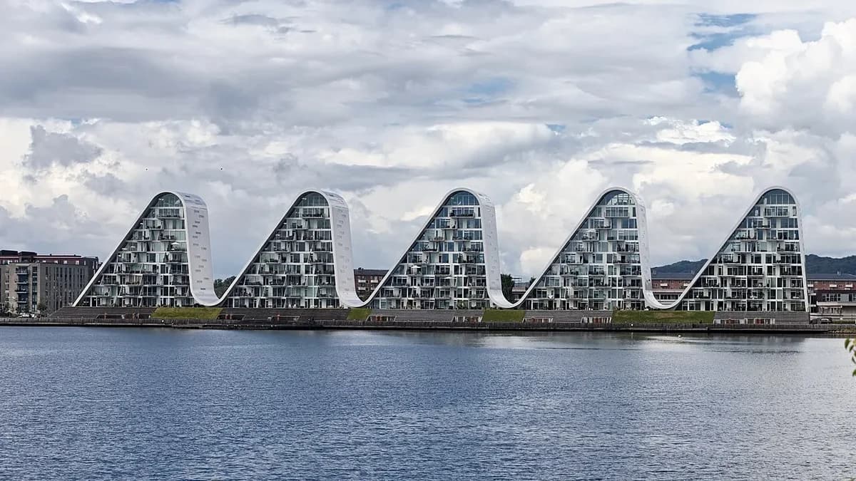 Wave-shaped apartment buildings along the waterfront in Vejle, Denmark.